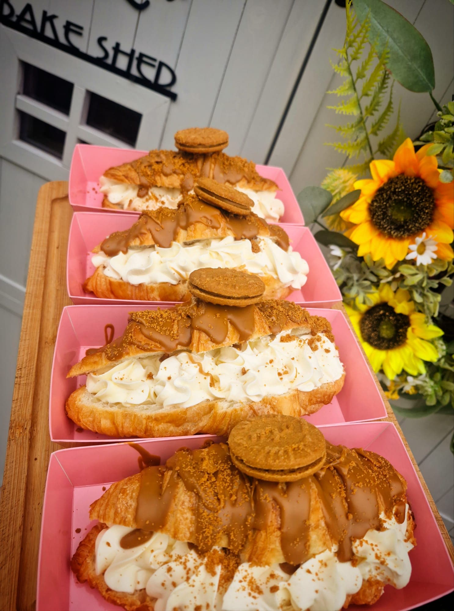 A tray of filled croissants on the bench outside the LoveLea bake shed