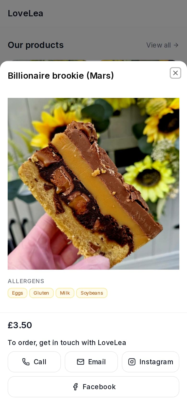 A product open on LoveLea Baking's shop page, showing its allergens (eggs, gluten, milk, soybeans) and Call, Email, Instagram and Facebook buttons to order